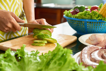 Cutting cucumber for salad