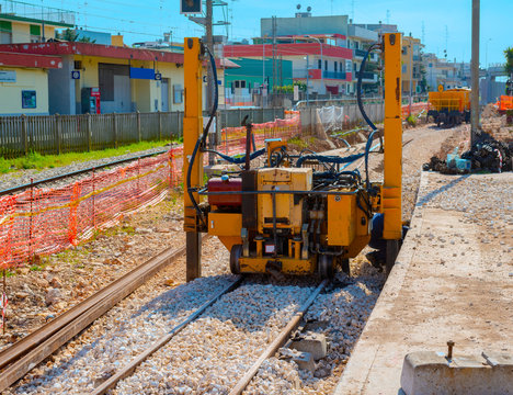Construction of a new railway line at a city station. Hydraulic lifting machines make it possible to lift, move laterally and lay points of various dimensions.