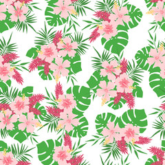 Seamless pattern with tropical leaves and flowers.