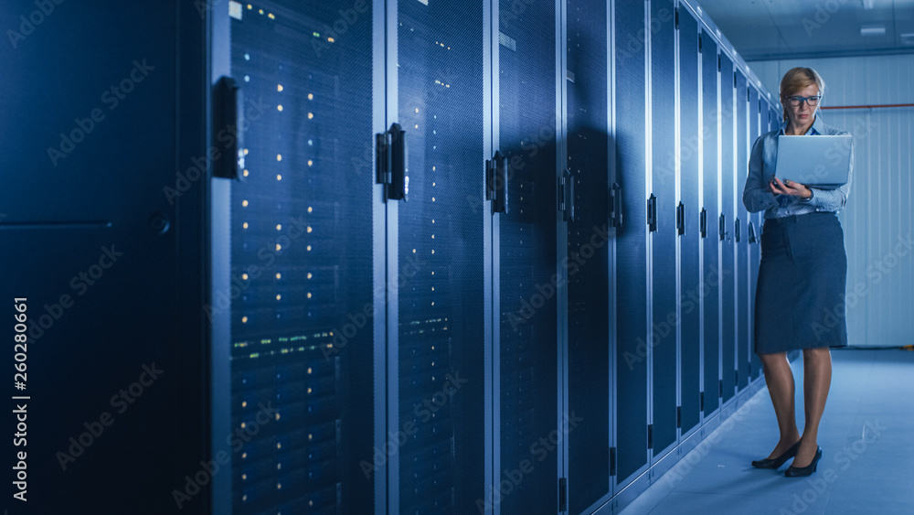 Aufkleber In Data Center: Female IT Technician Running Maintenance Programme on a Laptop, Controls Operational Server Rack Optimal Functioning. Modern High-Tech Telecommunications Operational Super Computer.