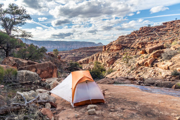 Camping on a platform of rock in the Royal Arch drainage, running water nearby, Grand Canyon...
