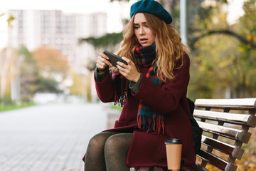Lovely upset young woman wearing coat