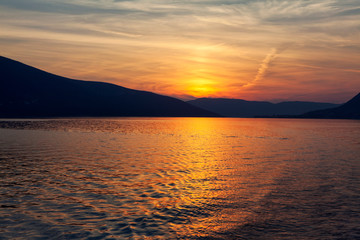 fantastic dusk with sea and mountains