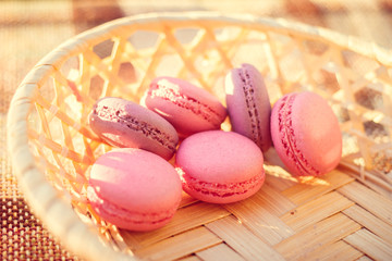 Pink pasta macarons at sunset. Pink macaroni. Delicious cakes.