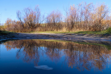 Autumn day in Arkhangelsk. Island Krasnoflotsky. the reflection in the water