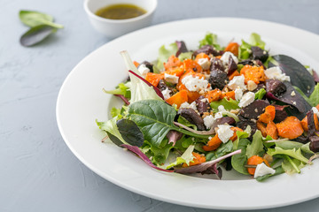 Baked beet and carrot salad with cheese