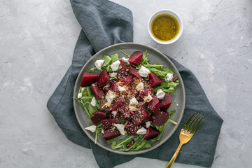 Beetroot salad with feta cheese, argula and walnuts