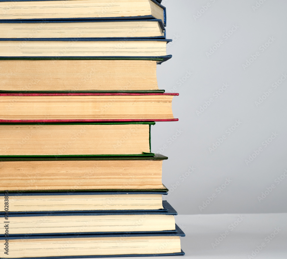 Aufkleber stack of different books on a gray background