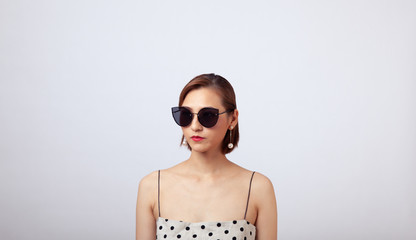 Chinese Girl wearing varies types of fashion sunglasses,looking sharp