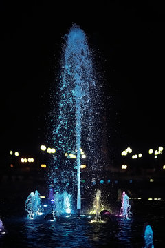 Fototapeta colorful night fountains / jets of colored water in a fountain, night illumination in the city, tourist object art
