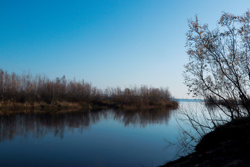 Autumn day in Arkhangelsk. Island Krasnoflotsky. the reflection in the water