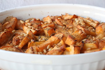 Homemade baked turnip with thyme and pine nuts