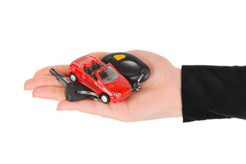 Hand with keys and car