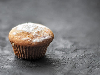 Cakes on a dark stone background