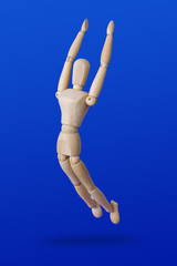 Sports wooden toy figure on blue