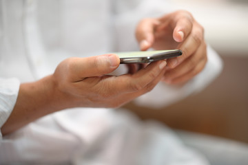 Close up of man using mobile smartphone