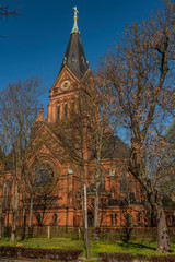 Fototapeta na wymiar Red church in spring sunny morning in Zwickau city in Germany
