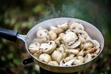 Cooking fresh mushrooms on camping stove