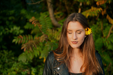 Naklejka premium Young beaut with flower in her hair
