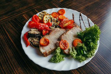 Grilled pork and pumpkin on a grill pan
