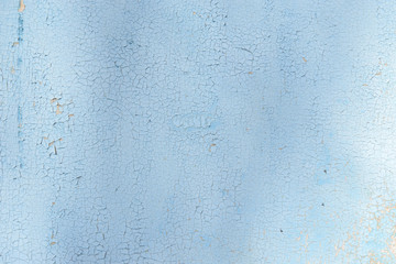 Old blue wall with peeling paint