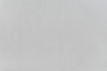 grey textured wall with stains