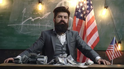 Global economics graph and dollar banknotes as finance concept. Serious man with a lot of money. Global economy concept funding. Progress in business usa flag background. Financial Stock Market Graphs - Powered by Adobe