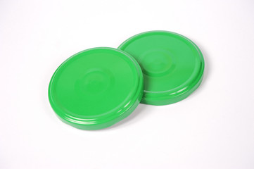 Screw caps for glass jars. For canning, canned food. Green caps on white background