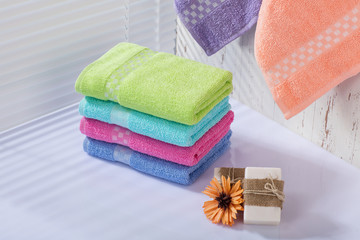 Colorful towels in bathroom.