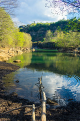 blue lake with many rocks around