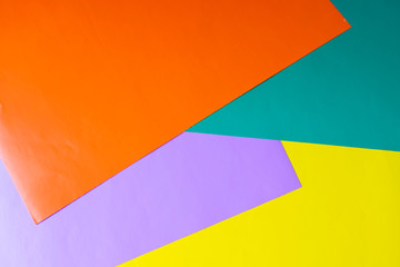 Multicolored horizontal background, colored cardboard. Yellow, orange and purple. Copy space