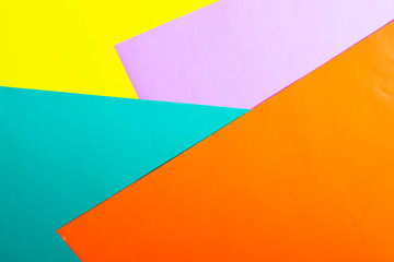 Multicolored horizontal background, colored cardboard. Yellow, orange and purple. Copy space