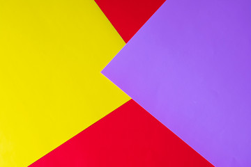 Multicolored horizontal background, colored cardboard. Yellow, red and purple
