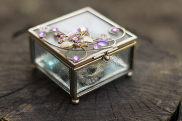 Old jewelry box with purple stones on the top
