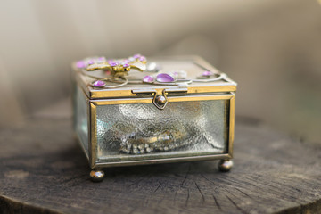 Old jewelry box with purple stones on the top