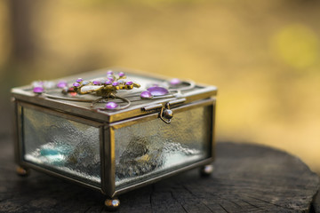 Old jewelry box with purple stones on the top