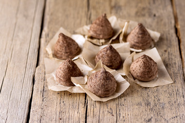 Homemade Tasty Chocolate Truffle Candy on the Old Wooden Background tasty Dessert Copy Space