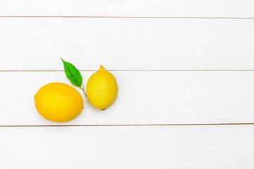 fresh lemons on wooden table.