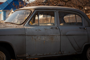 Photo of one old car in the village