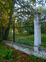 Old fence in the old autumn park - 260297247