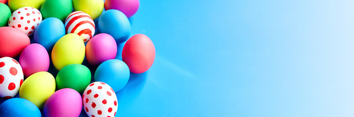 Fototapeta na wymiar Colorful Easter eggs on blue background