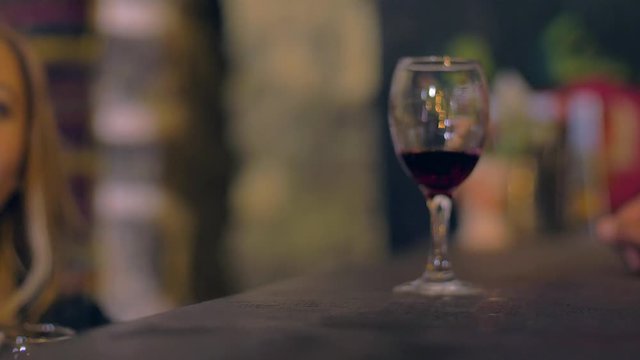 Tasting wine in a  old cellar The taster takes the glass of wine