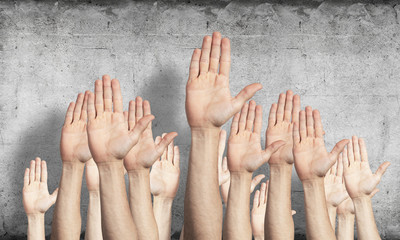 Row of man hands showing voting gesture