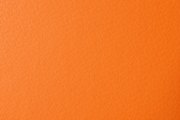 Fototapeta premium Texture of orange leather as background, closeup