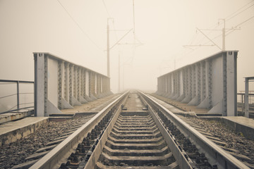 Fog on the railway. Foggy Russian railway. Morning fog.