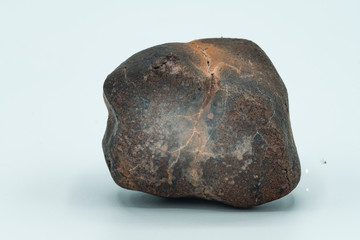 Chondrite Meteorite isolated, a piece of rock formed in outer space in the early stages of Solar...