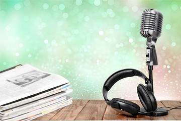News and microphone on table.