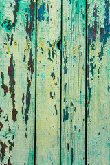 Old wooden background of boards with cracked and peeling paint