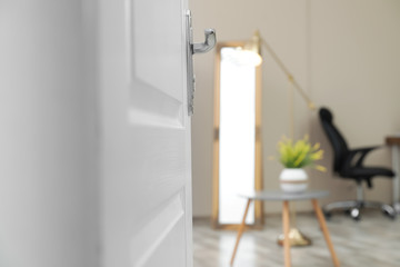 Stylish room interior, view through open door