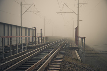 Fototapeta na wymiar Fog on the railway. Foggy Russian railway. Morning fog.